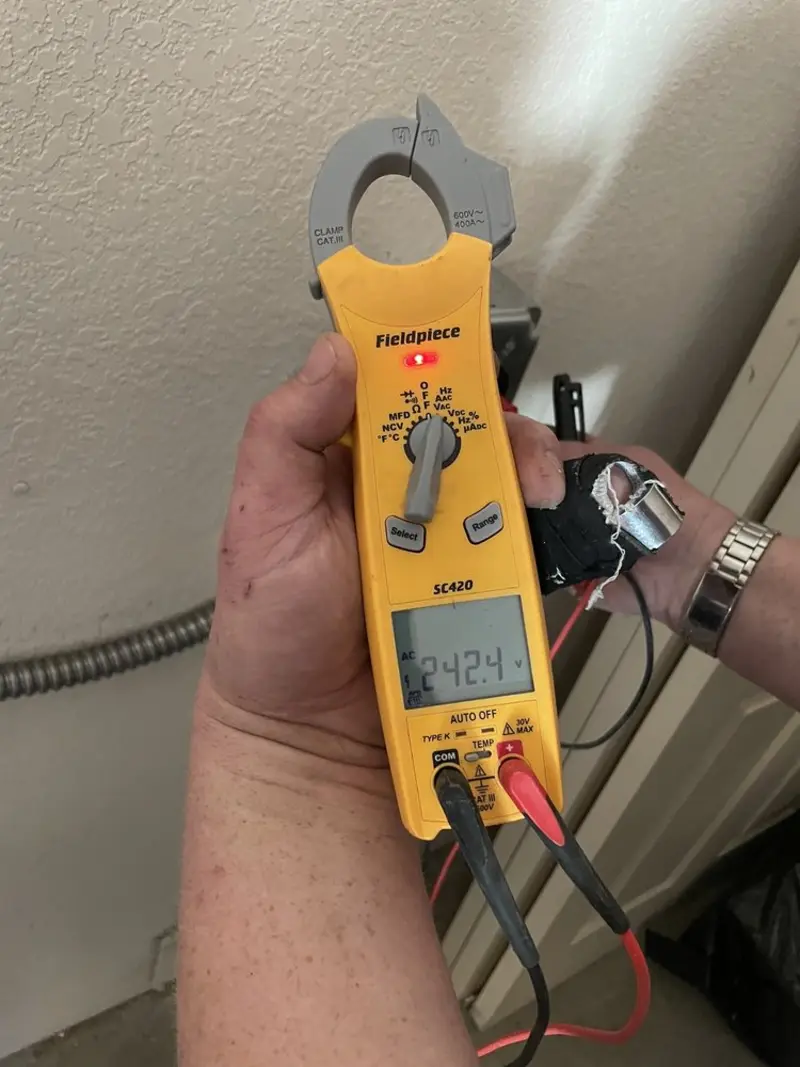 Voltage testing with clamp meter during Outlet Installation in Mokena